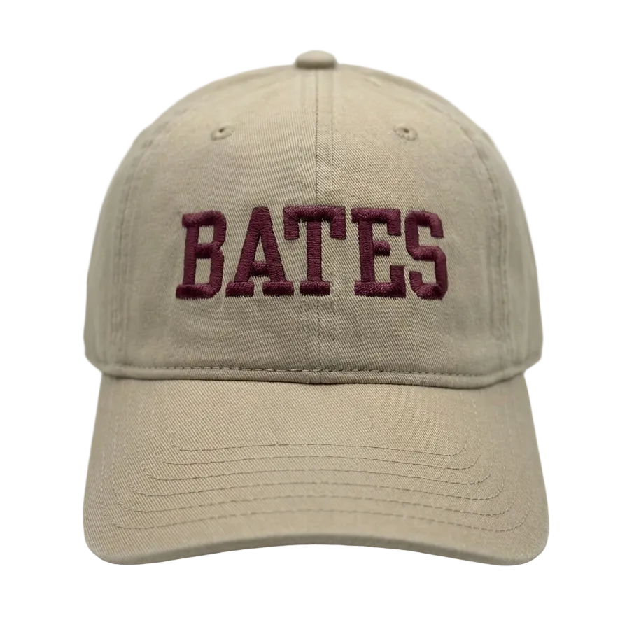 Beige cap with 'BATES' embroidered on a white background