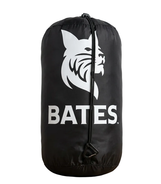 Black blanket bag with Bates logo on a wooden surface
