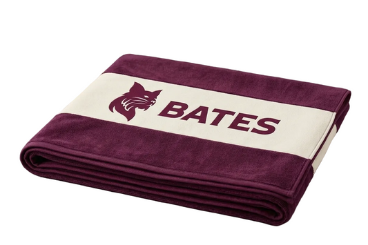 Folded towel with 'Bates' logo on a white background