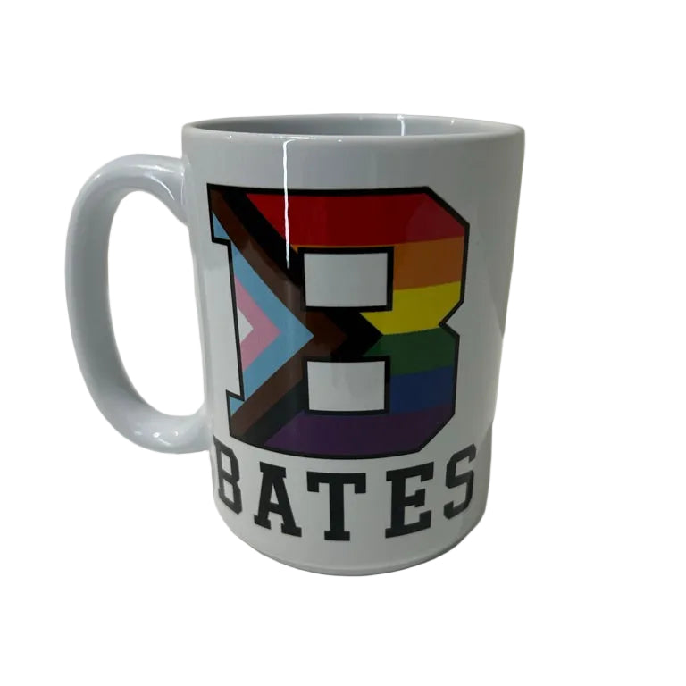 White mug with rainbow design and 'BATES' text on a white surface