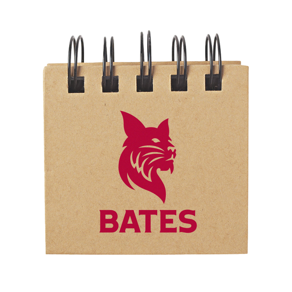 Kraft paper notebook with red 'BATES' logo featuring a lion on a white background