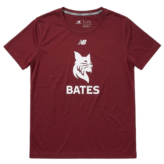 A maroon short-sleeve athletic t-shirt by New Balance, featuring a white bobcat graphic and the name 'BATES' printed on the front, laid flat against a light gray background.